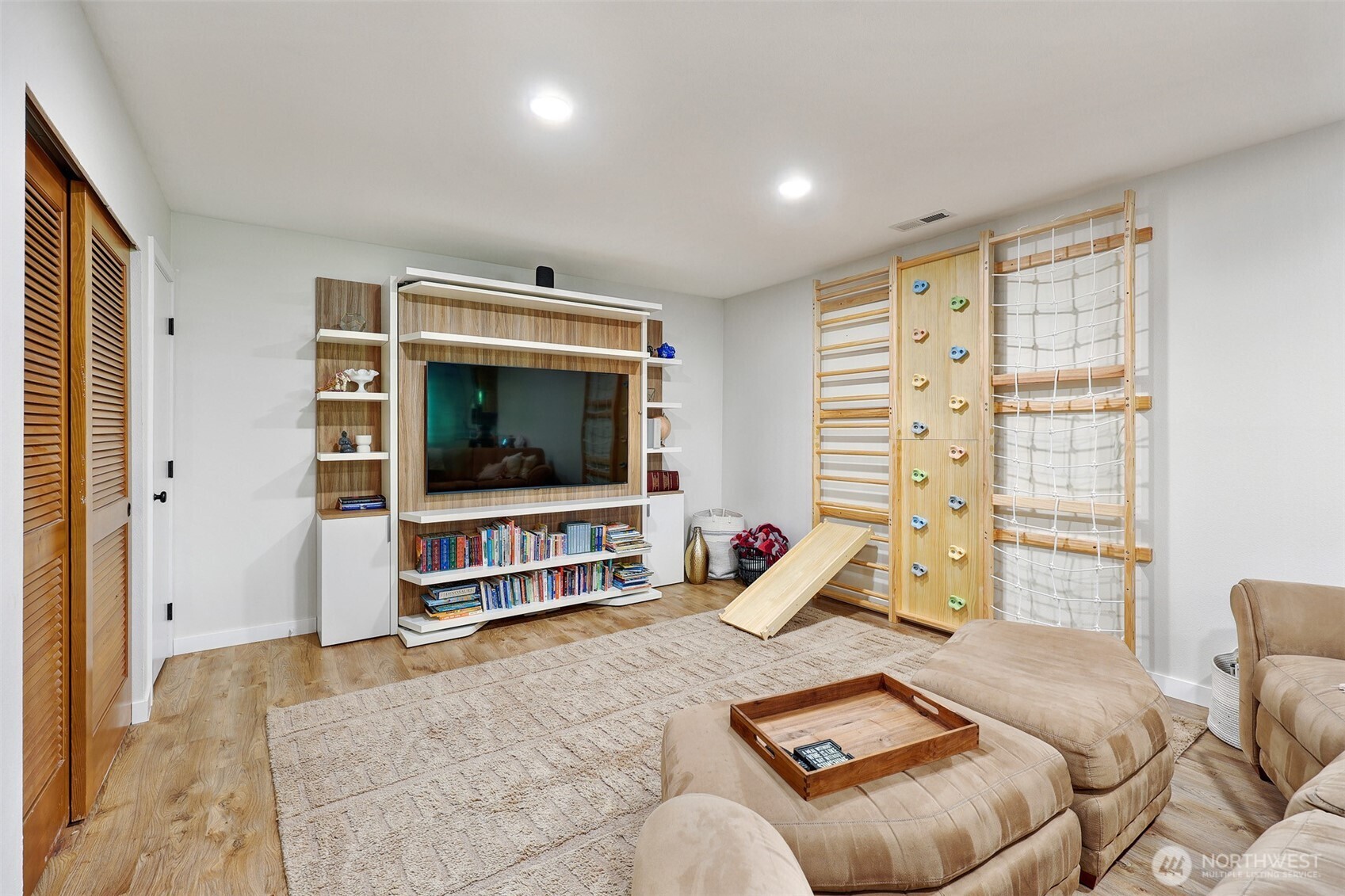 5126 South Garden Loop Road, Unit 11 Seattle, WA 98118 - Photo 22 of 36 a living room with furniture a flat screen tv and a window
