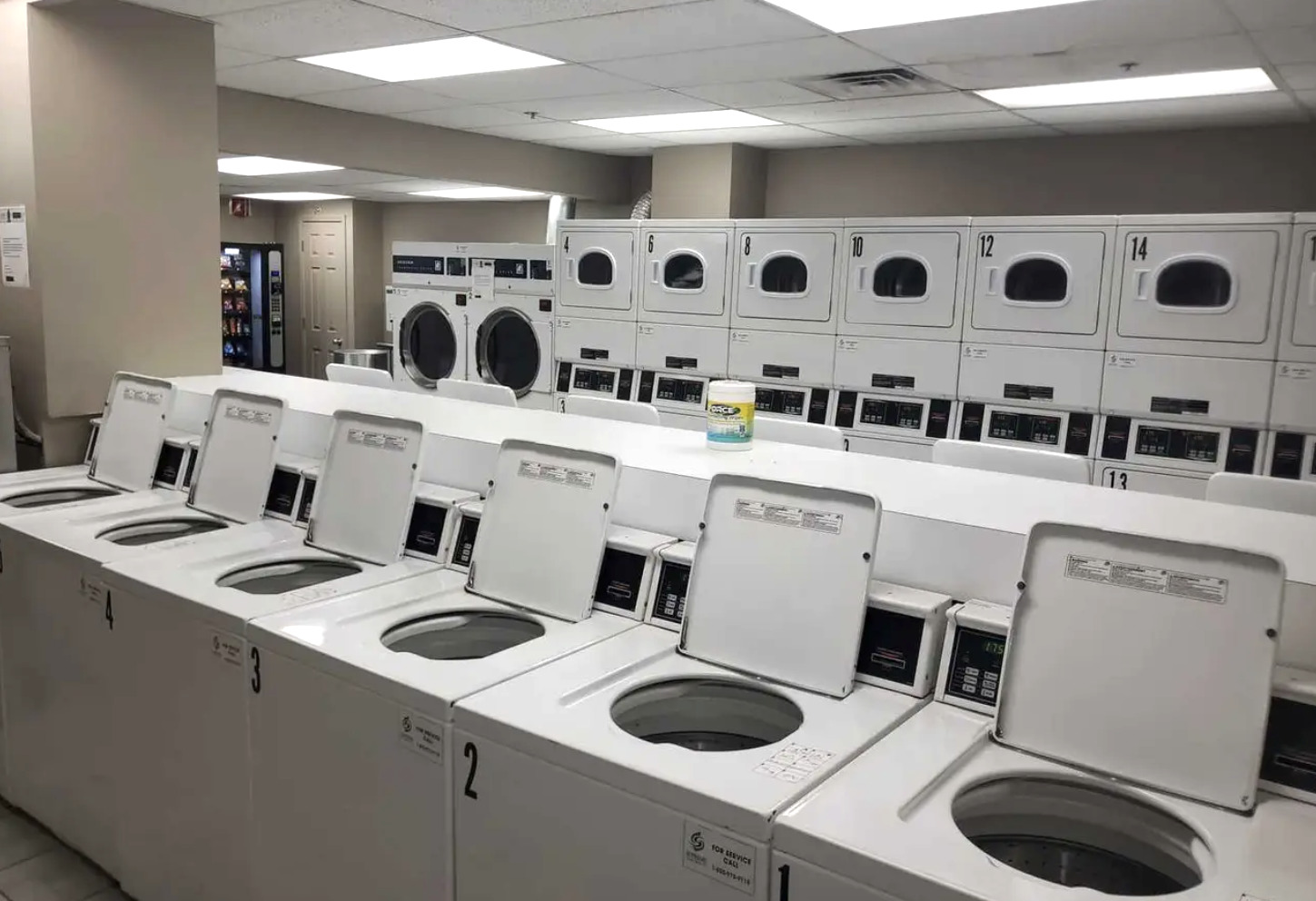 5320 North Sheridan Road, Unit 2110 Chicago, IL 60640 - Photo 16 of 16 a kitchen with kitchen island a stove a sink and a refrigerator