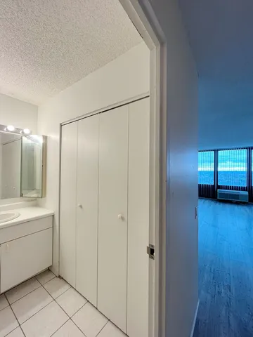 a bathroom with a sink a mirror and a shower