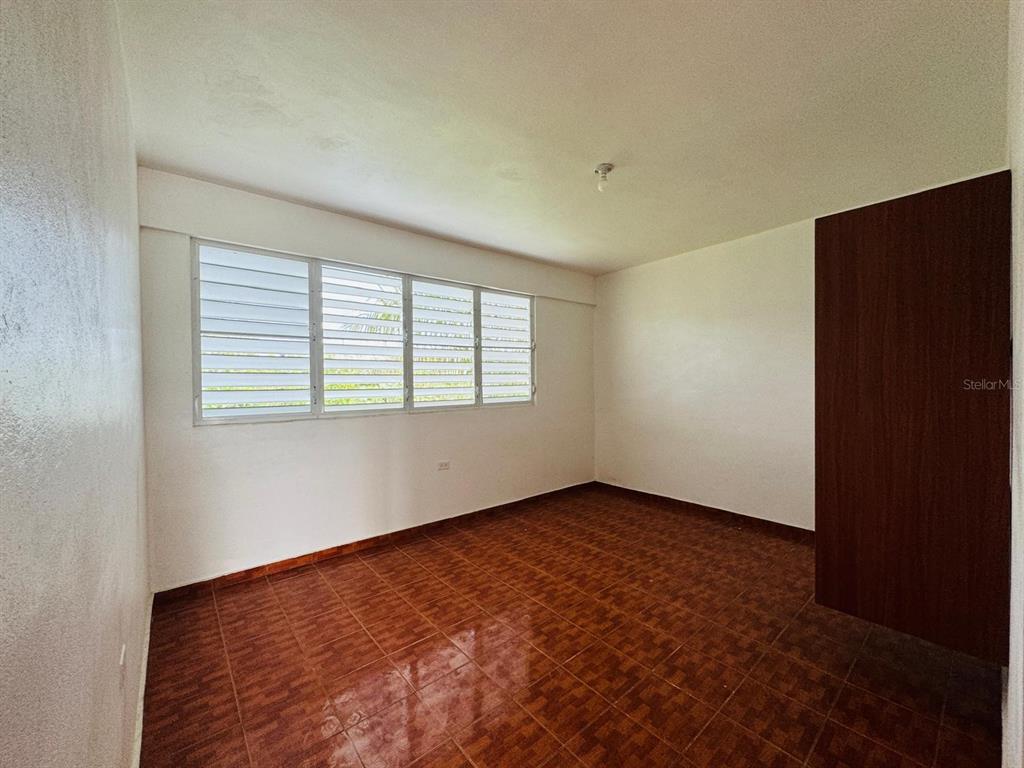 908 Bo Tejas, Unit 7 Humacao, PR 00791 - Photo 6 of 7 an empty room with a window