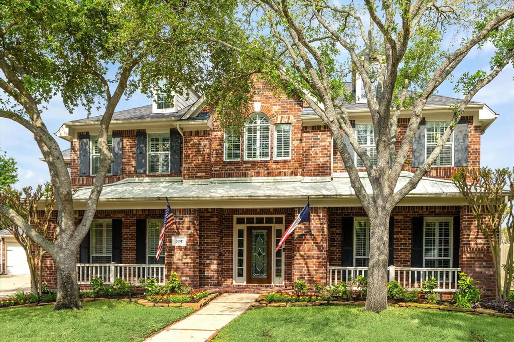 20911 Blooming Pear Court Cypress, TX 77433 - Photo 1 of 50 front view of a house with a yard