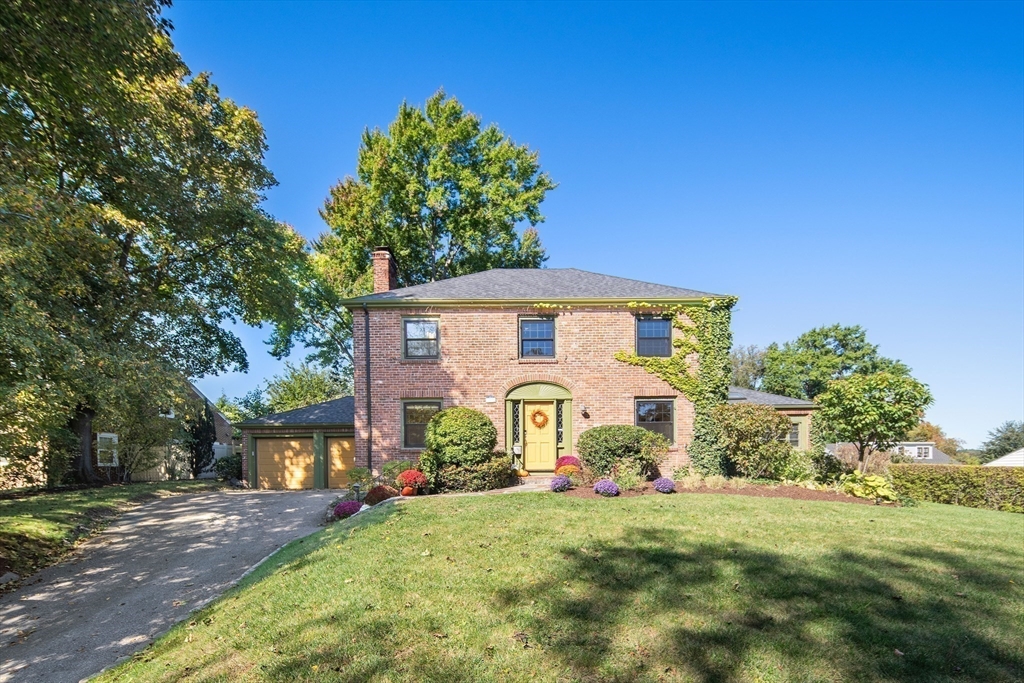 a front view of a house with garden