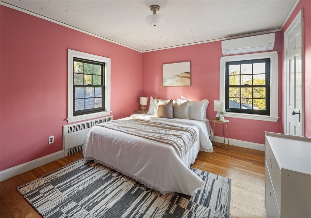 263 Common Street Belmont, MA 02478 - Photo 21 of 31 a bedroom with a bed and wooden floor