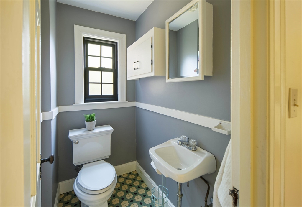 263 Common Street Belmont, MA 02478 - Photo 23 of 31 a bathroom with a toilet sink and mirror