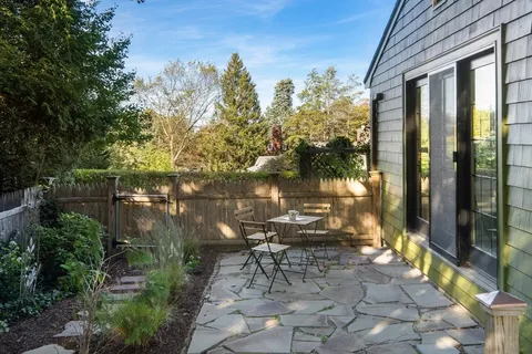 a view of yard with patio