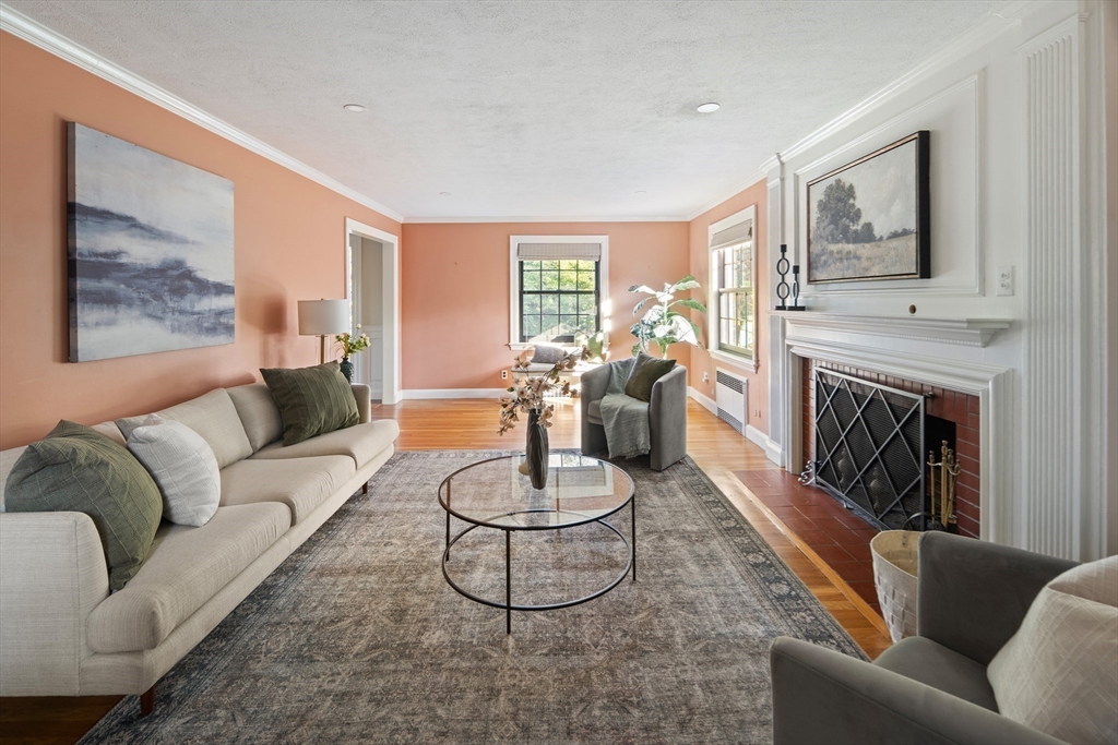 263 Common Street Belmont, MA 02478 - Photo 9 of 31 a living room with furniture fireplace and a large window