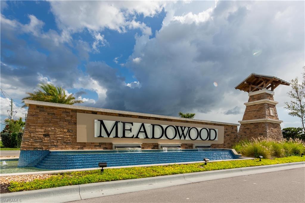 15307 Wildflower Circle Naples, FL 34119 - Photo 1 of 26 a view of swimming pool with outdoor seating and yard in the back