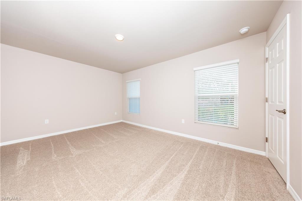 15307 Wildflower Circle Naples, FL 34119 - Photo 15 of 26 a view of an empty room with a window