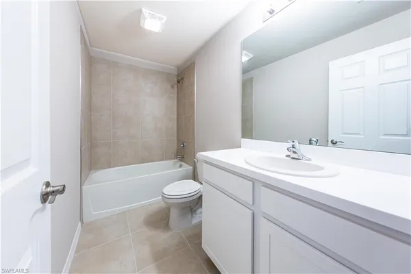 a bathroom with a sink a toilet and bathtub