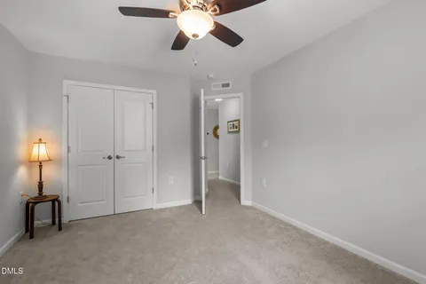 a bathroom with double vanity sink and a mirror