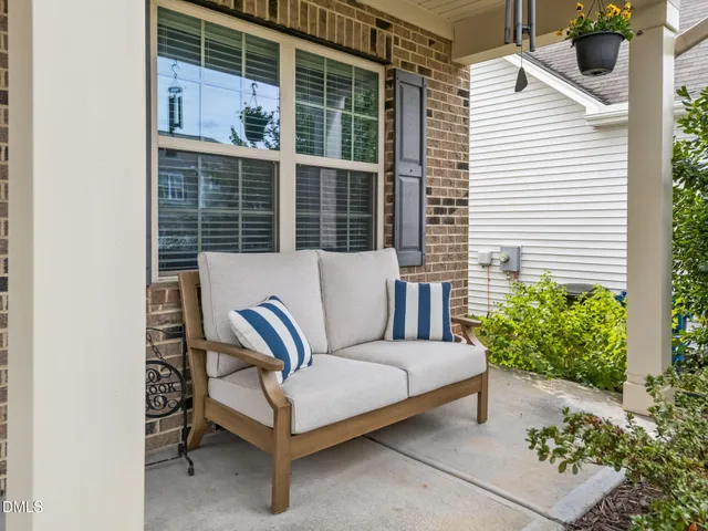 a view of a two chairs in the patio