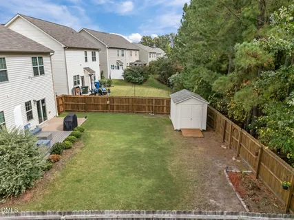 a backyard of a house with seating space