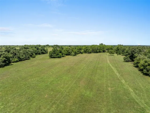 a view of a lake with houses in the background