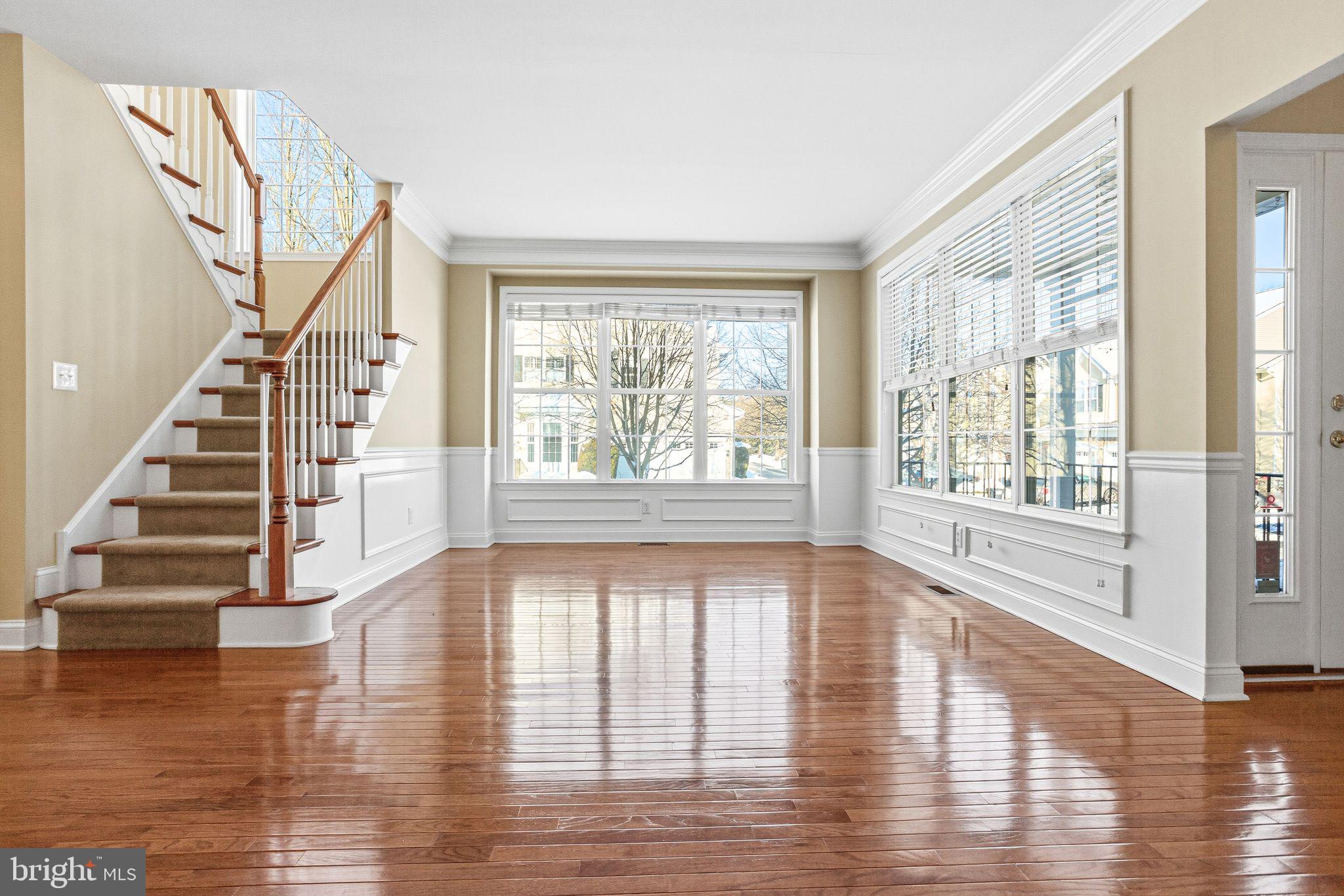 99 Longview Lane Newtown Square, PA 19073 - Photo 15 of 50 a view of an empty room with wooden floor and windows