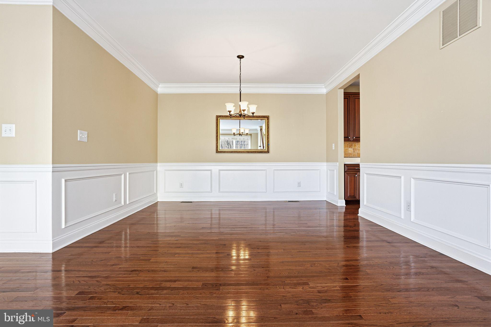 99 Longview Lane Newtown Square, PA 19073 - Photo 17 of 50 a view of an empty room with window and wooden floor