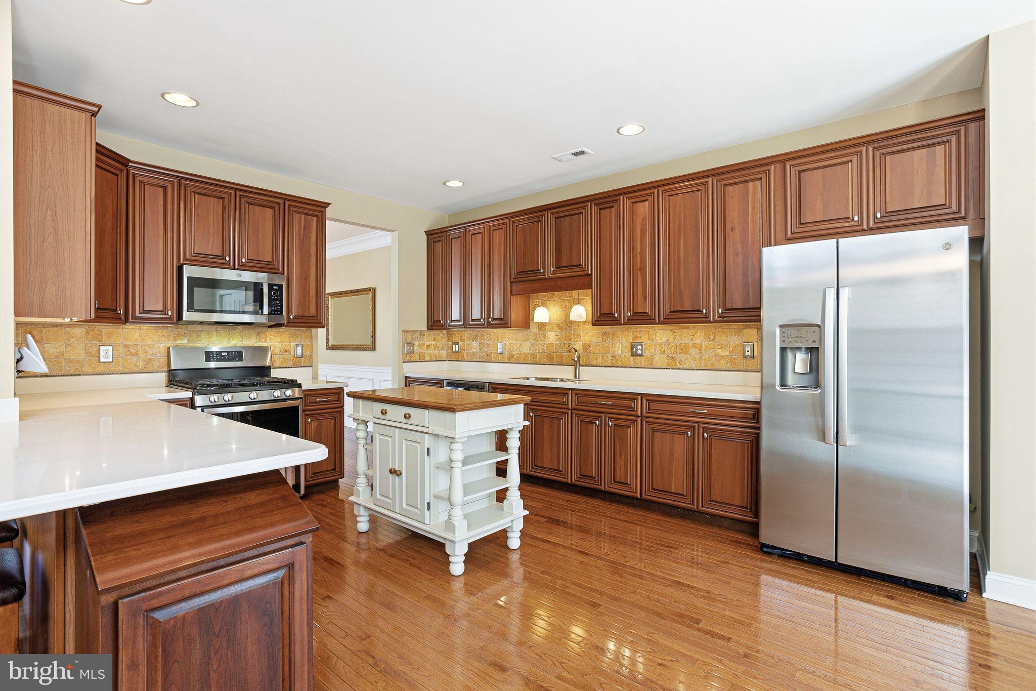 99 Longview Lane Newtown Square, PA 19073 - Photo 19 of 50 a kitchen with a refrigerator stove top oven and sink