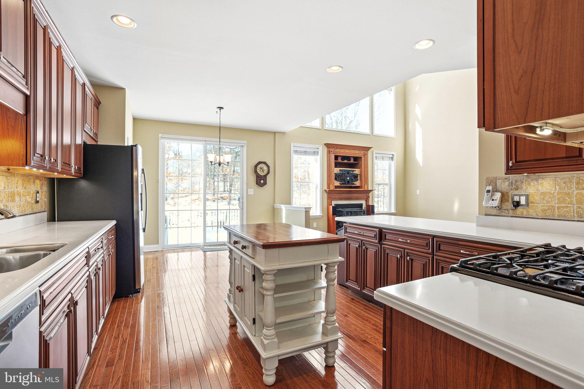 99 Longview Lane Newtown Square, PA 19073 - Photo 20 of 50 a kitchen with a sink a stove and a refrigerator