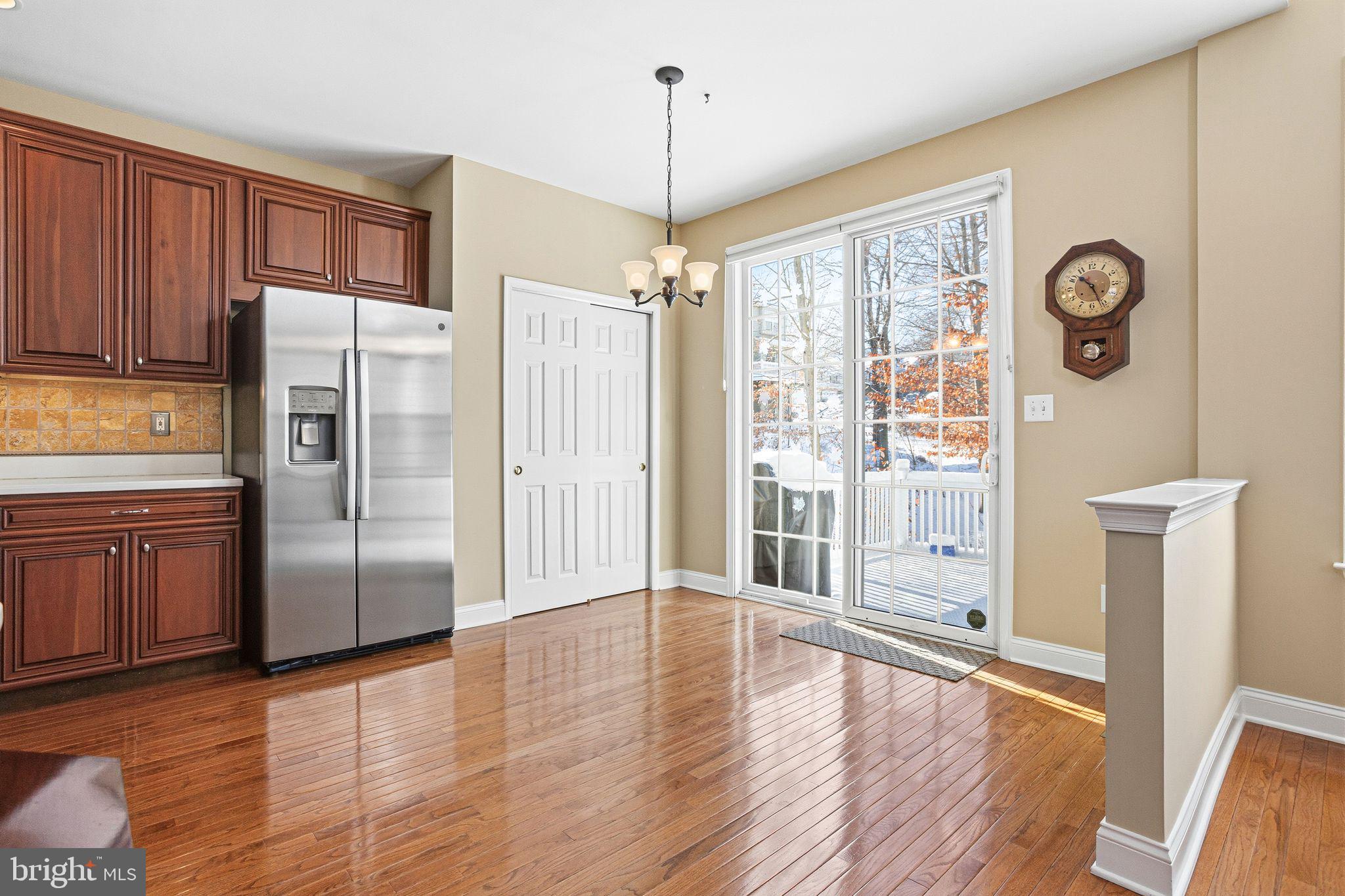 99 Longview Lane Newtown Square, PA 19073 - Photo 21 of 50 a kitchen with stainless steel appliances granite countertop a refrigerator a stove and a wooden floors