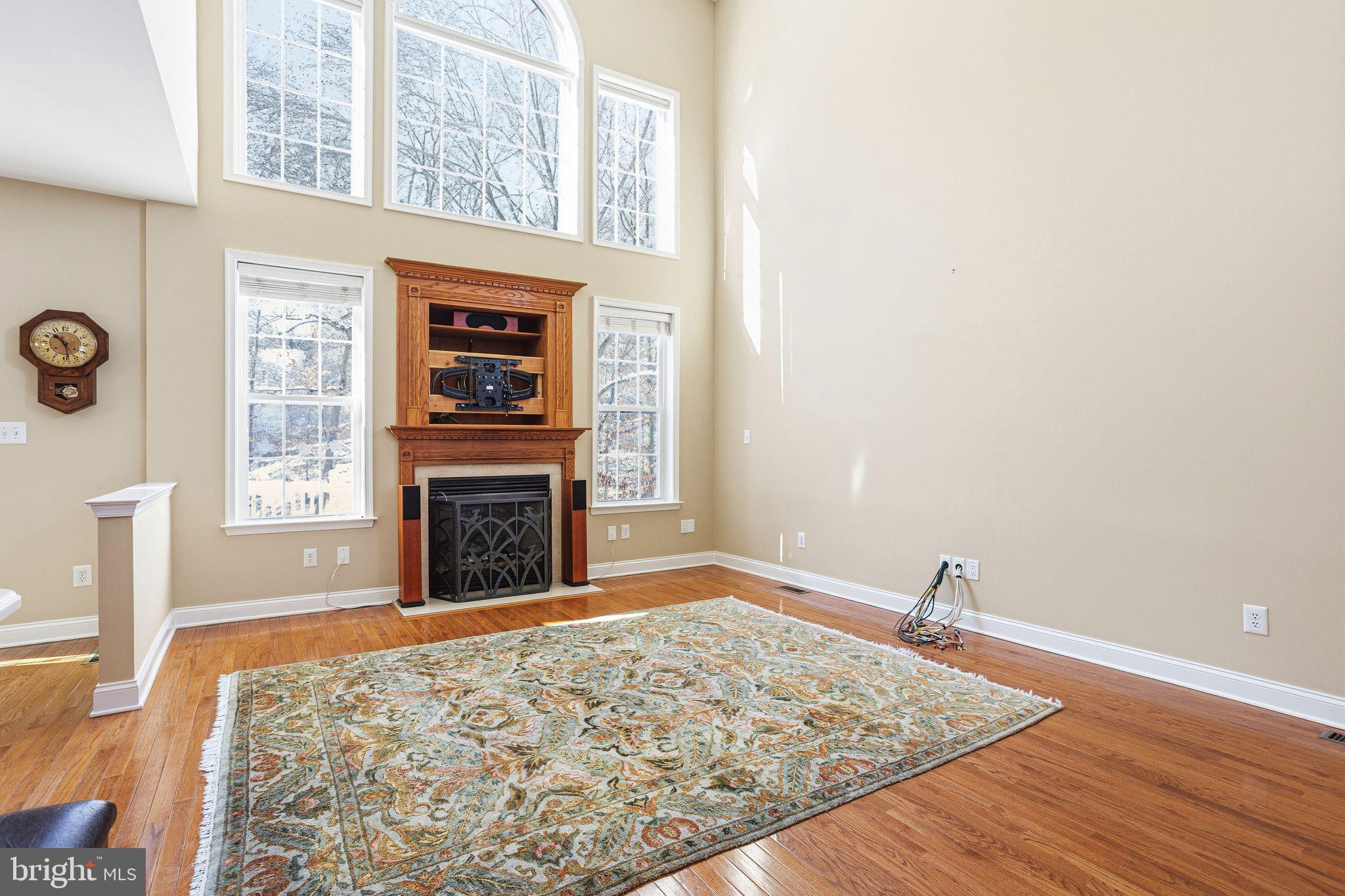 99 Longview Lane Newtown Square, PA 19073 - Photo 24 of 50 a view of a livingroom with wooden floor and a fireplace
