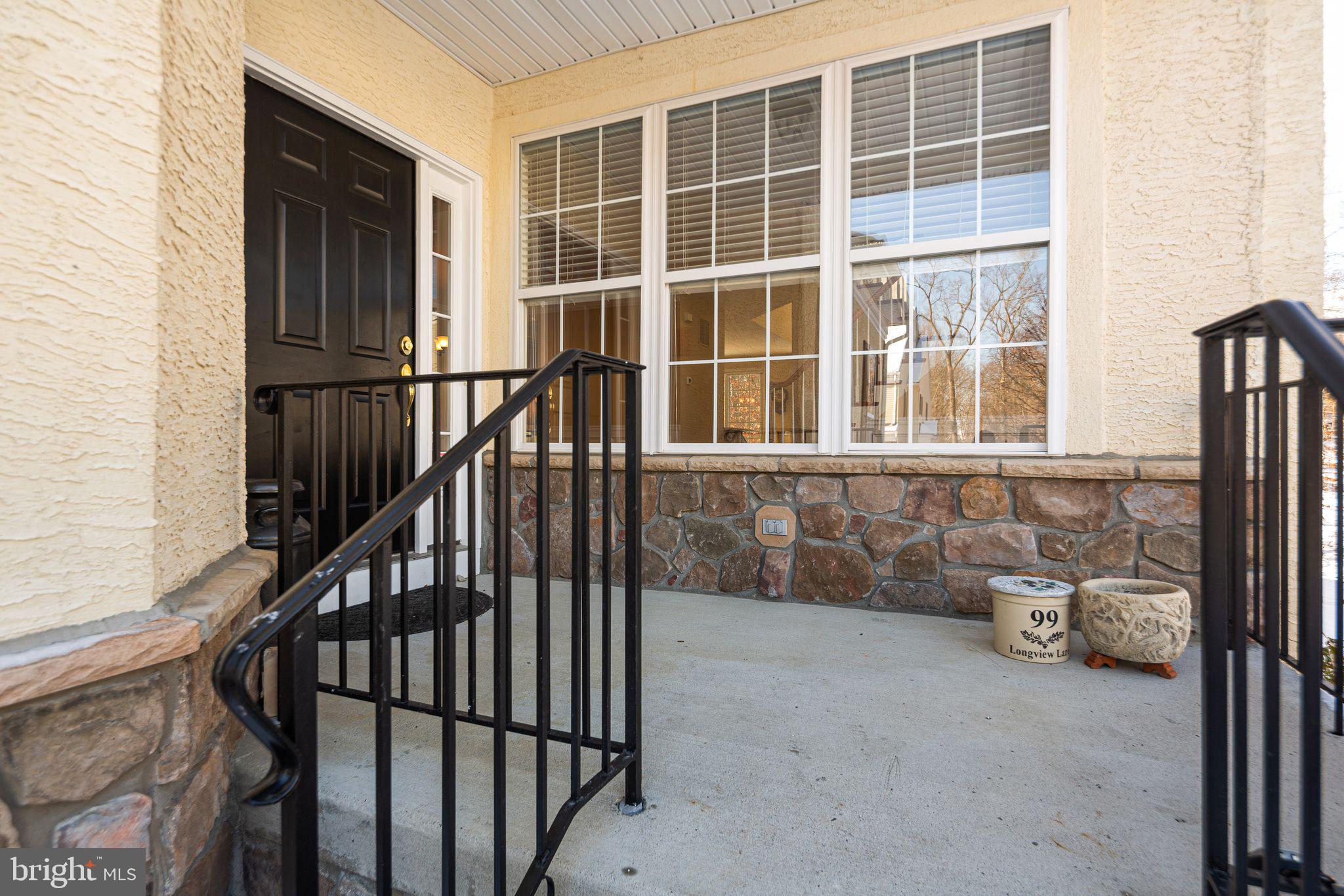 99 Longview Lane Newtown Square, PA 19073 - Photo 3 of 50 front view of a house with a large window