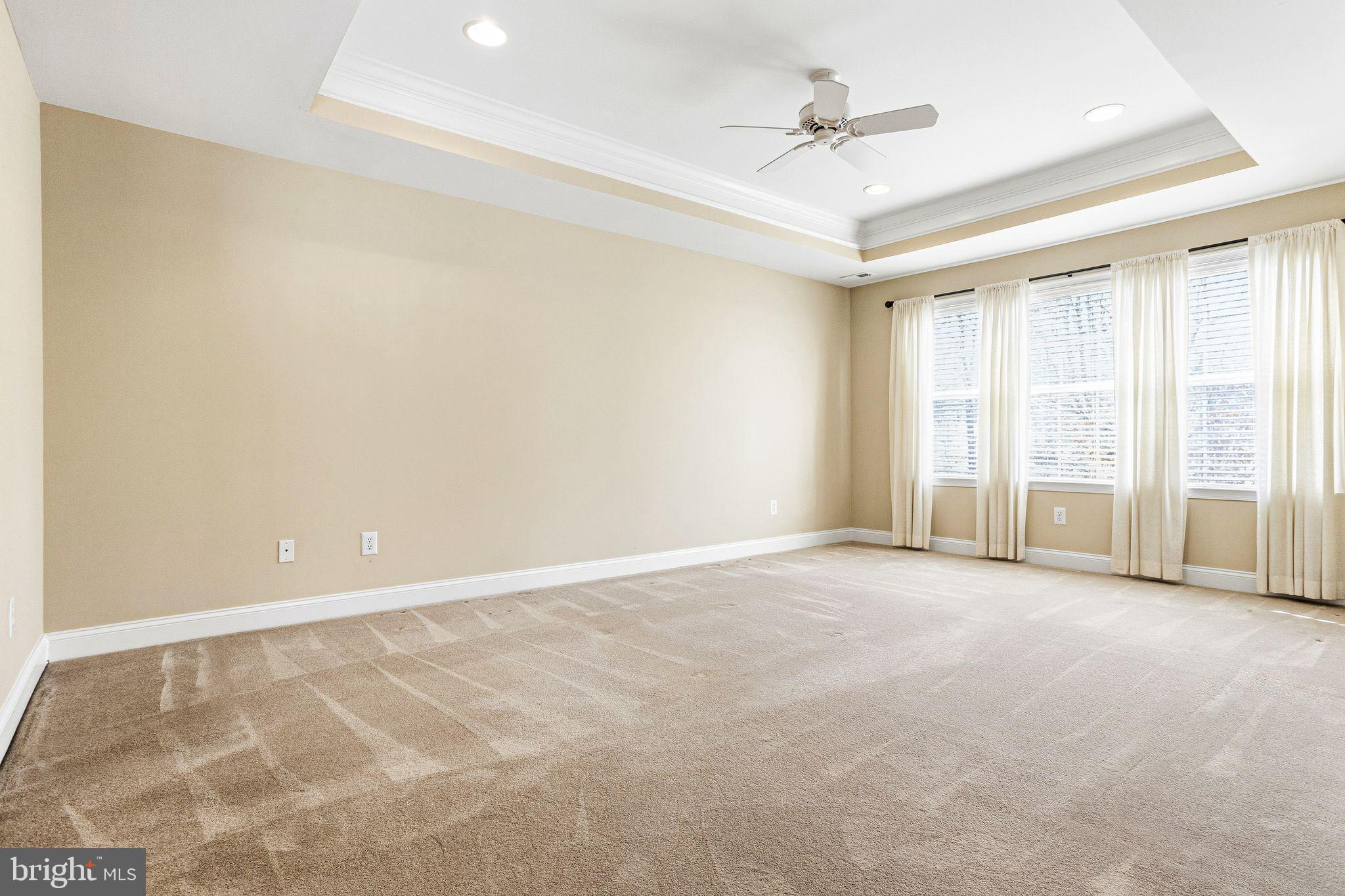 99 Longview Lane Newtown Square, PA 19073 - Photo 31 of 50 an empty room with windows and ceiling fan