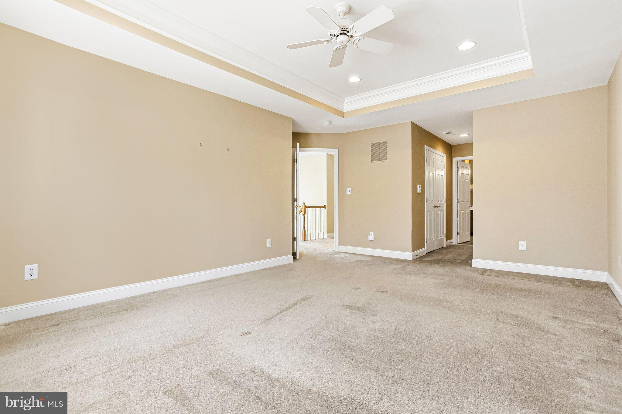99 Longview Lane Newtown Square, PA 19073 - Photo 32 of 50 an empty room with a ceiling fan and a window
