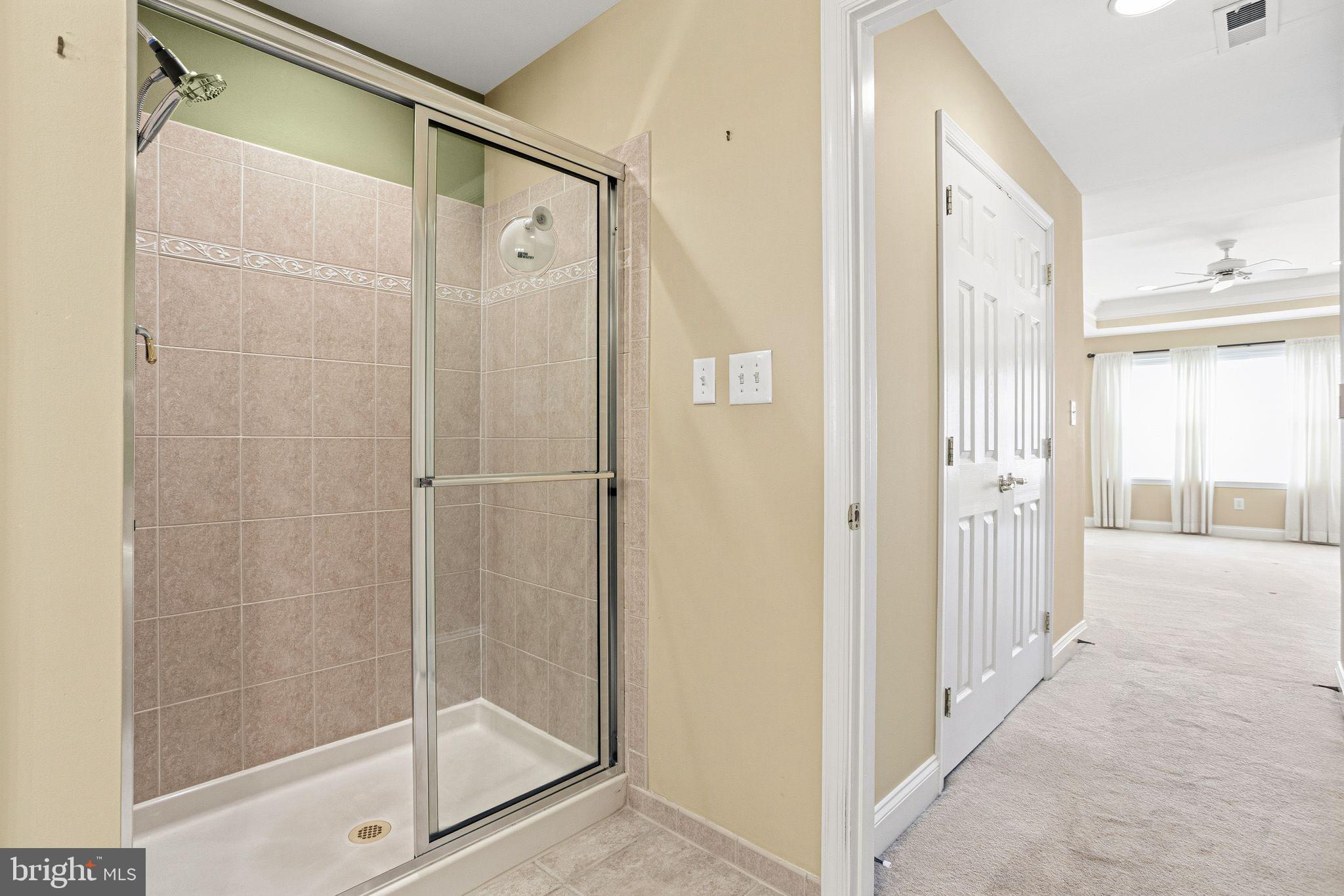 99 Longview Lane Newtown Square, PA 19073 - Photo 38 of 50 a bathroom with a glass shower door