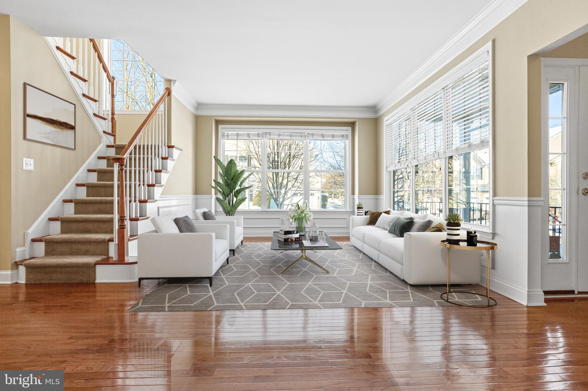 99 Longview Lane Newtown Square, PA 19073 - Photo 7 of 50 a living room with fireplace furniture and floor to ceiling windows
