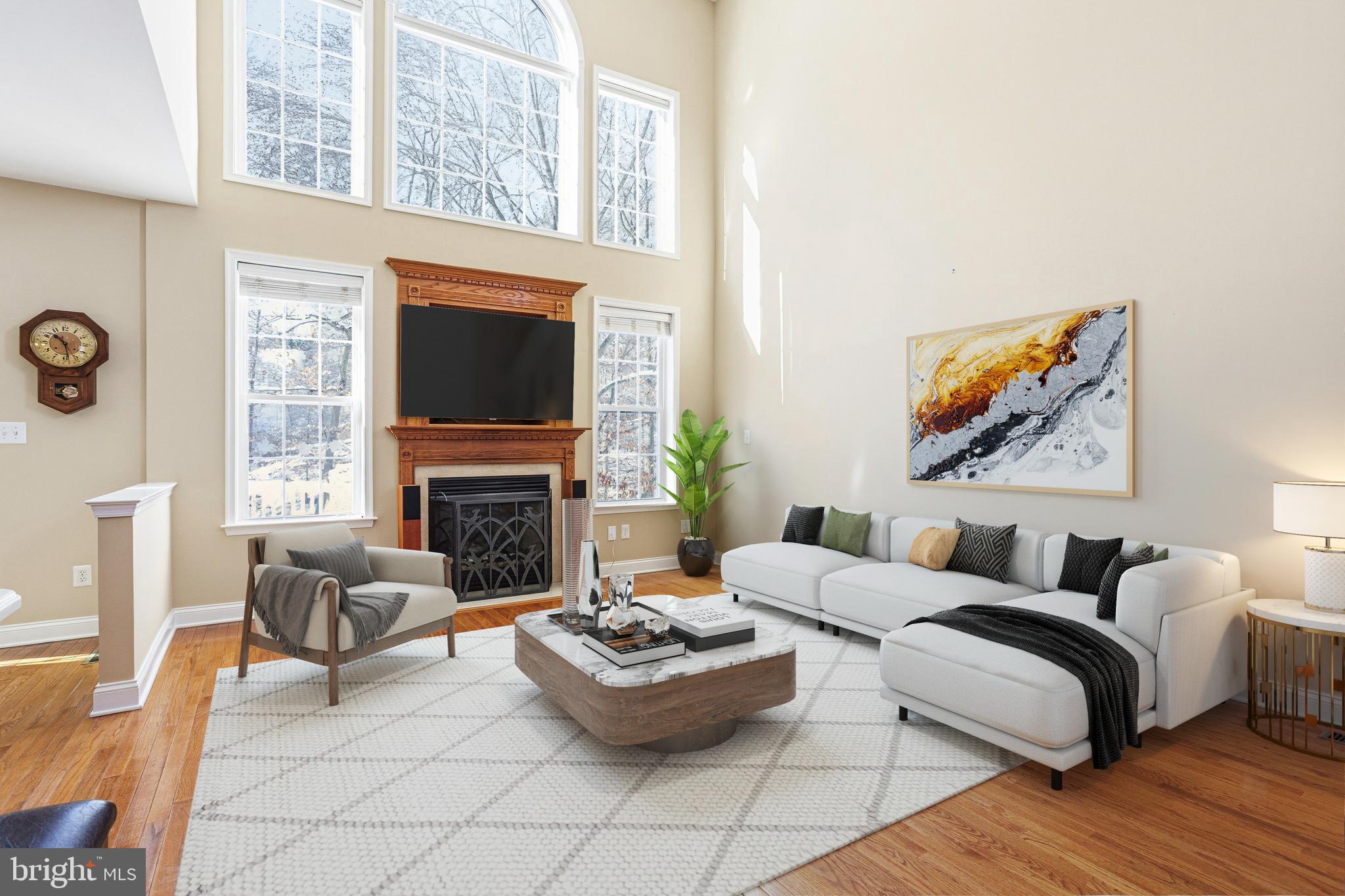 99 Longview Lane Newtown Square, PA 19073 - Photo 9 of 50 a living room with fireplace furniture and a flat screen tv