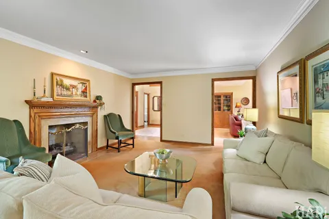 a bedroom with a bed and large window