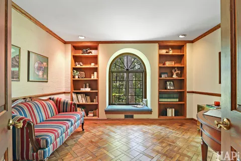 a bedroom with furniture and a window