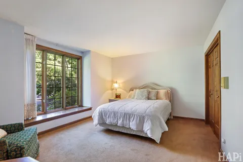 a bathroom with a double vanity sink mirror and shower