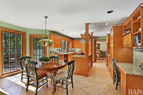 a view of a dining room with furniture window and outside view