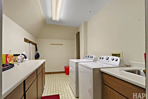 a dining room with a table and chairs