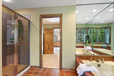 a bedroom with a bed chair and window