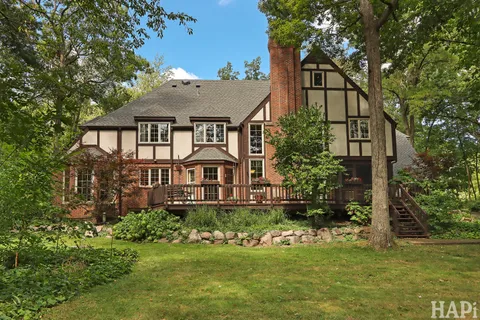 a view of a house with a tree