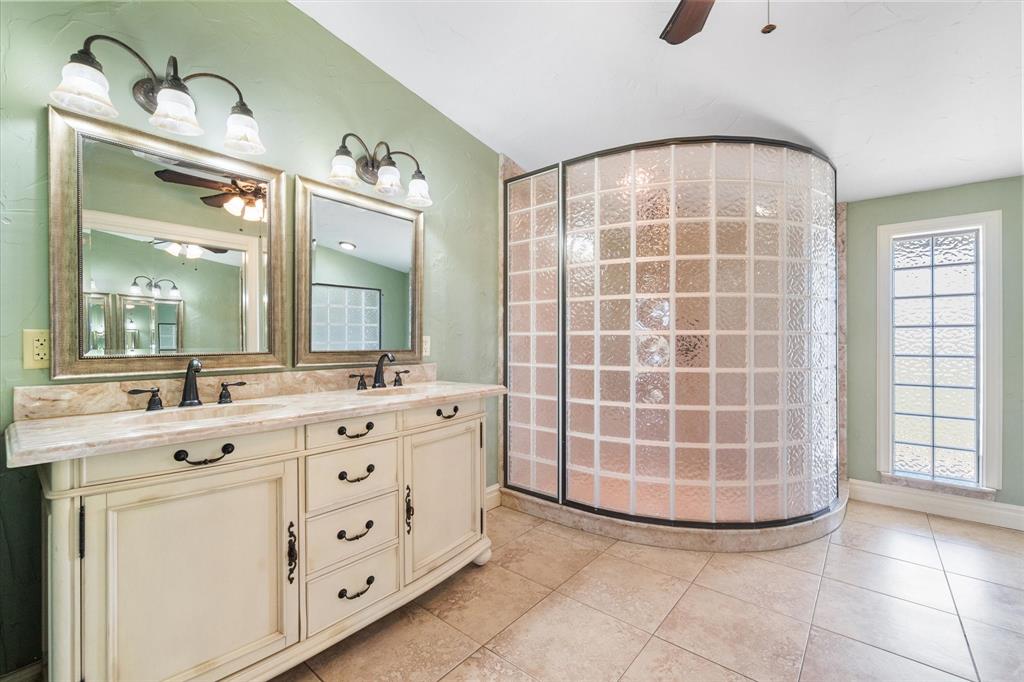340 Farm To Market 27 Fairfield, TX 75840 - Photo 11 of 40 a bathroom with a double vanity sink mirror and