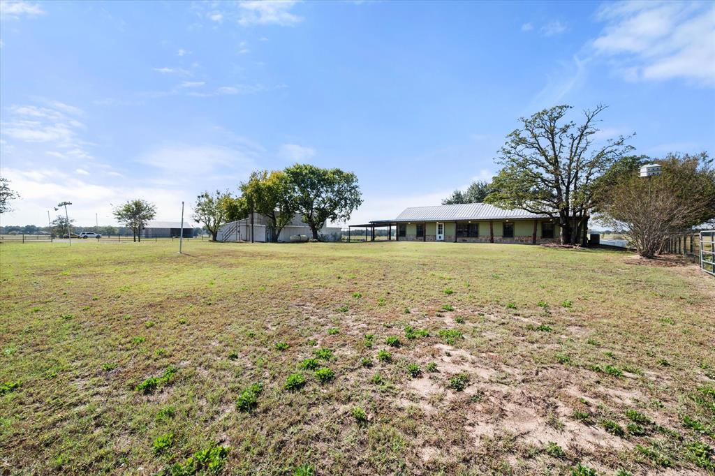 340 Farm To Market 27 Fairfield, TX 75840 - Photo 15 of 40 a view of a green field with trees in the background