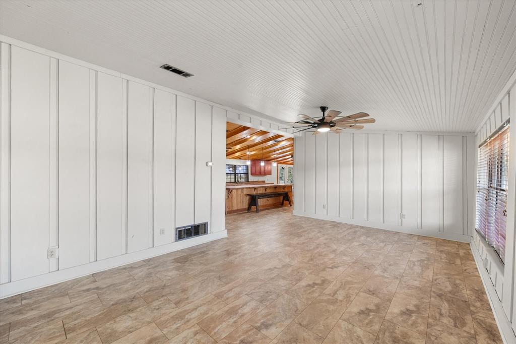 340 Farm To Market 27 Fairfield, TX 75840 - Photo 3 of 40 an empty room with windows and chandelier fan