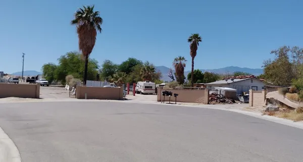 a view of roof deck with potted plants