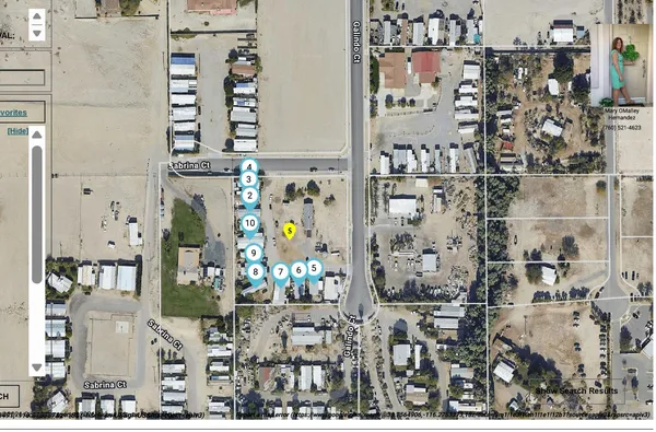 a view of a house with a snow in the background