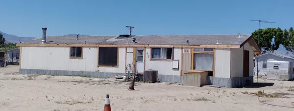 a view of a house with a snow in the yard