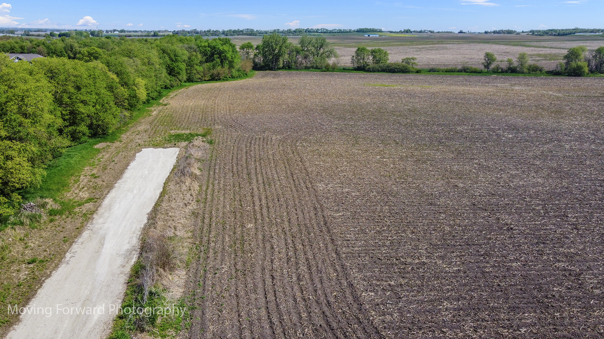 16011 Indian Road Newark, IL 60541 - Photo 3 of 7 a view of a road with a yard