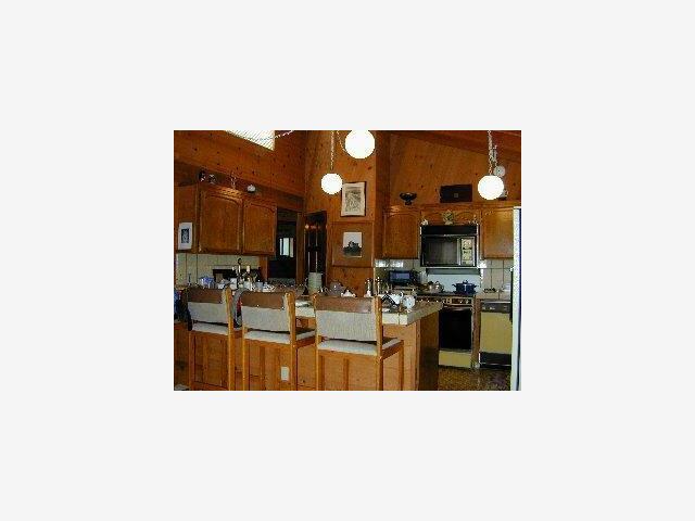 425 Martin Road Santa Cruz, CA 95060 - Photo 5 of 6 a open kitchen with cabinets and stainless steel appliances