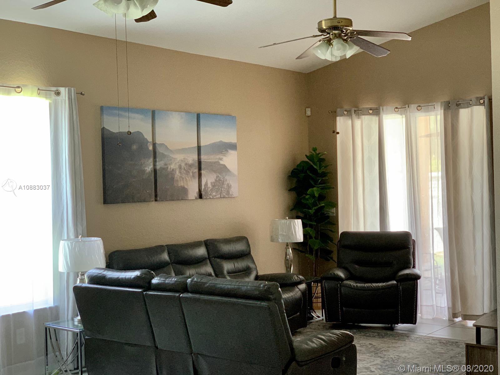 2329 Northeast 37th Road Homestead, FL 33033 - Photo 12 of 24 a living room with furniture and a window
