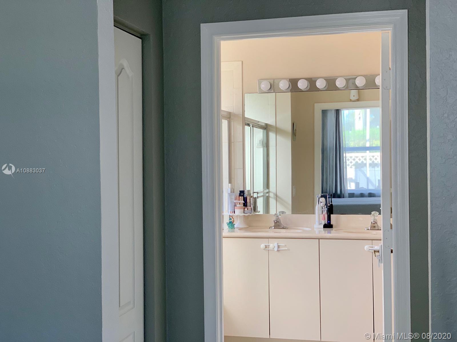 2329 Northeast 37th Road Homestead, FL 33033 - Photo 18 of 24 a bathroom with a sink and a mirror