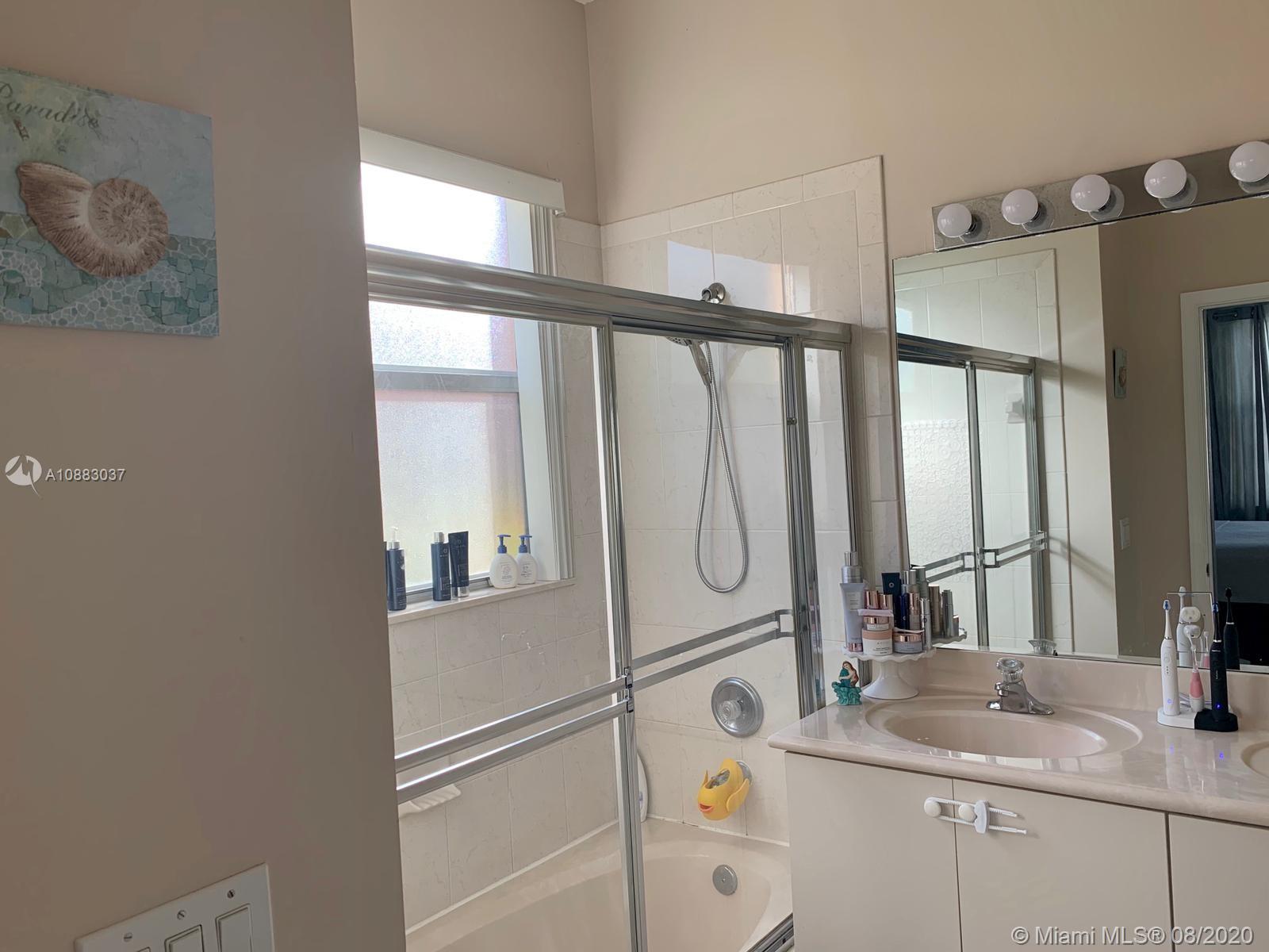 2329 Northeast 37th Road Homestead, FL 33033 - Photo 20 of 24 a bathroom with a granite countertop sink and a mirror