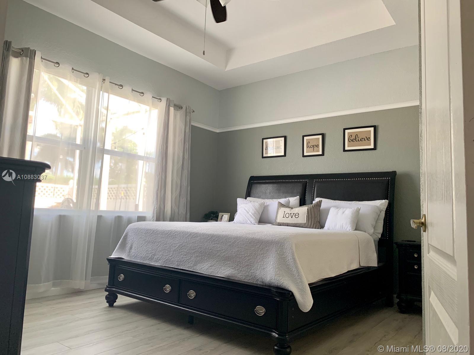 2329 Northeast 37th Road Homestead, FL 33033 - Photo 23 of 24 a bedroom with a bed and window