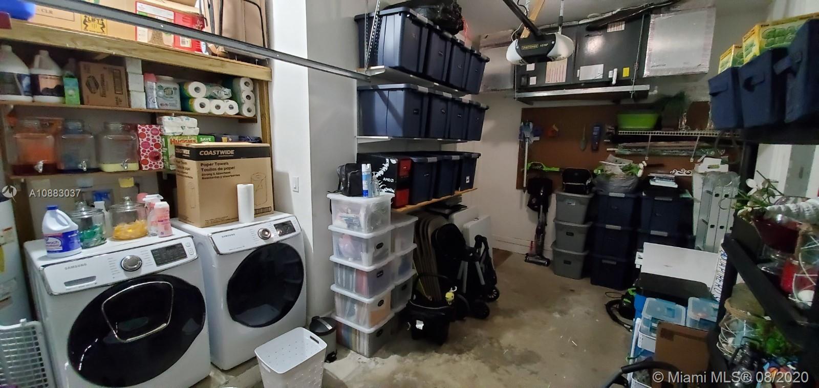 2329 Northeast 37th Road Homestead, FL 33033 - Photo 24 of 24 a view of walk in closet with clothes and shoes