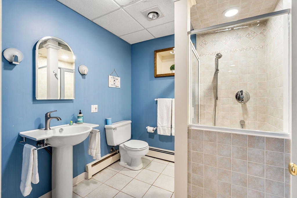 58 Leicester Road Marblehead, MA 01945 - Photo 36 of 42 a bathroom with a toilet sink and shower
